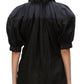 A person wearing the 3.1 Phillip Lim Lantern Sleeve Combo Shirt exudes feminine elegance, viewed from behind.