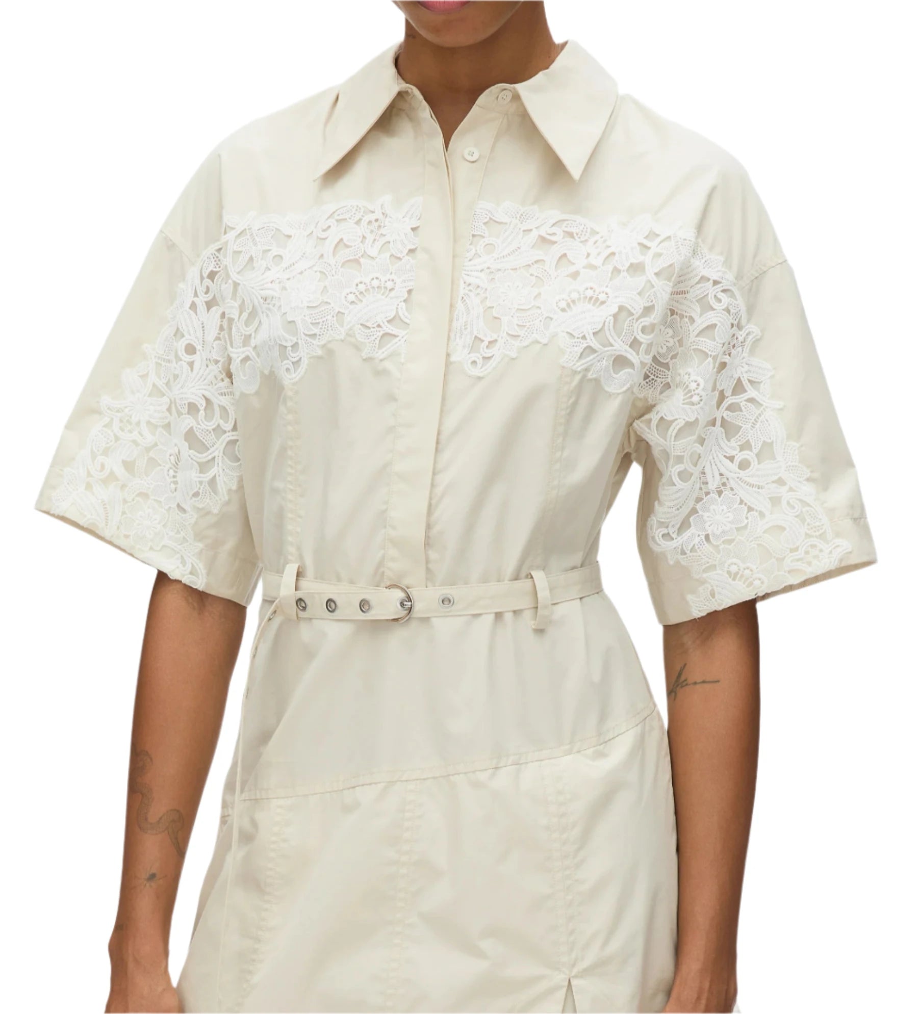 Someone dressed in the 3.1 Phillip Lim Cascade Belted Combo Lace Shirt Dress showcases a blend of casual elegance with its lace panels on the shoulders and a waist-cinching belt.