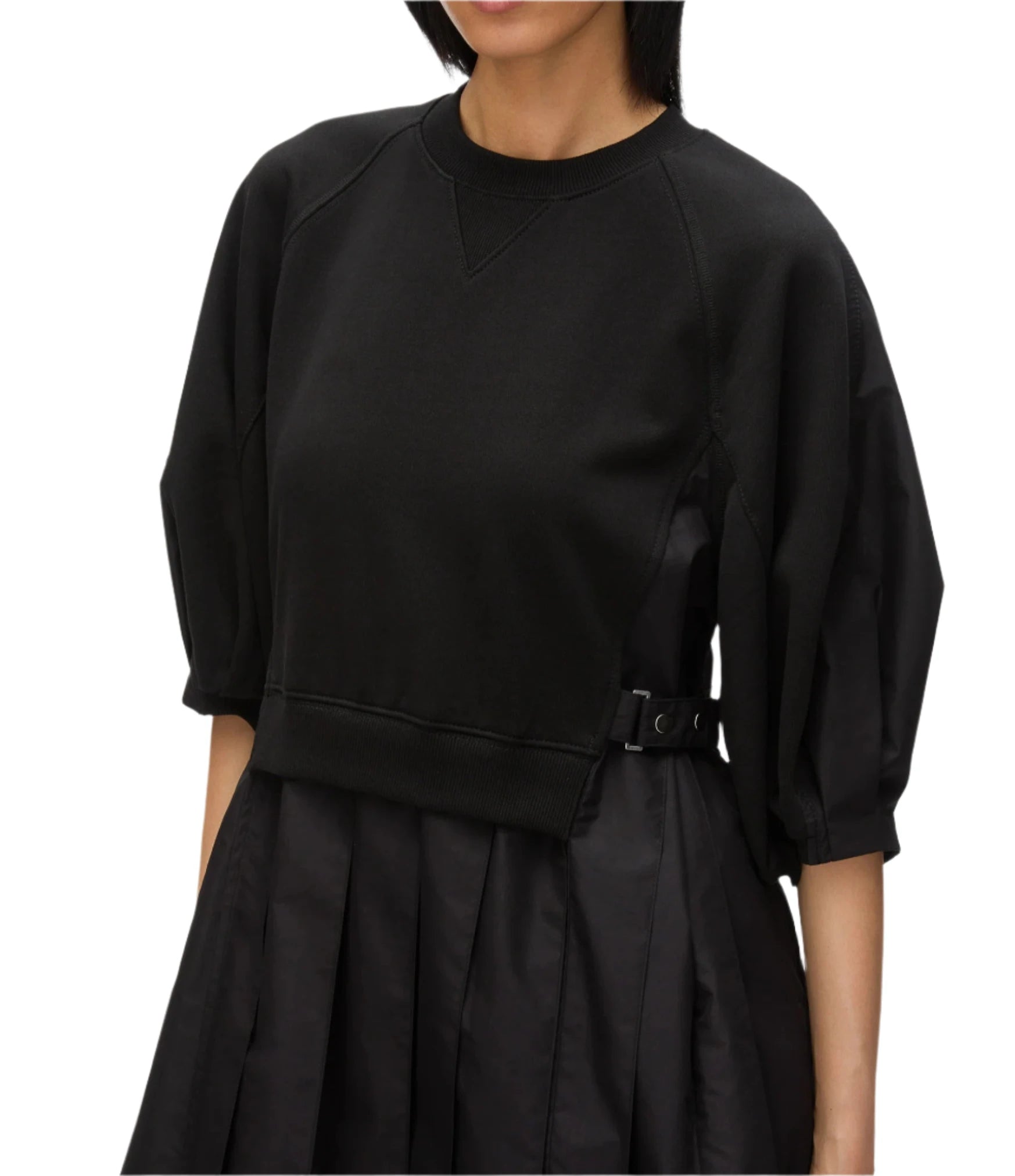 A person wearing the 3.1 Phillip Lim Lantern Sleeve Sweatshirt Dress in black.