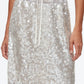A person wears the 3.1 Phillip Lim Sequin Pull On Skirt, a white sequin midi with a drawstring waistband, paired with a tucked-in white top; only the skirt and torso are visible.