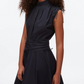 A woman models the 3.1 Phillip Lim Ruched Handkerchief Dress—a sleeveless, high-neck black dress with a fitted waist and subtle gathers—in crisp technical poplin, standing against a plain white background.