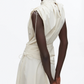 Model wears the 3.1 Phillip Lim Ruched Handkerchief Dress, a sleeveless technical poplin style with drawstring shoulders and waist, photographed from the back against a plain white background.