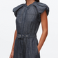 A woman wears the 3.1 Phillip Lim Denim Puff Sleeve Dress, a belted midi with short puff sleeves, pleated shoulders, and a high neckline.