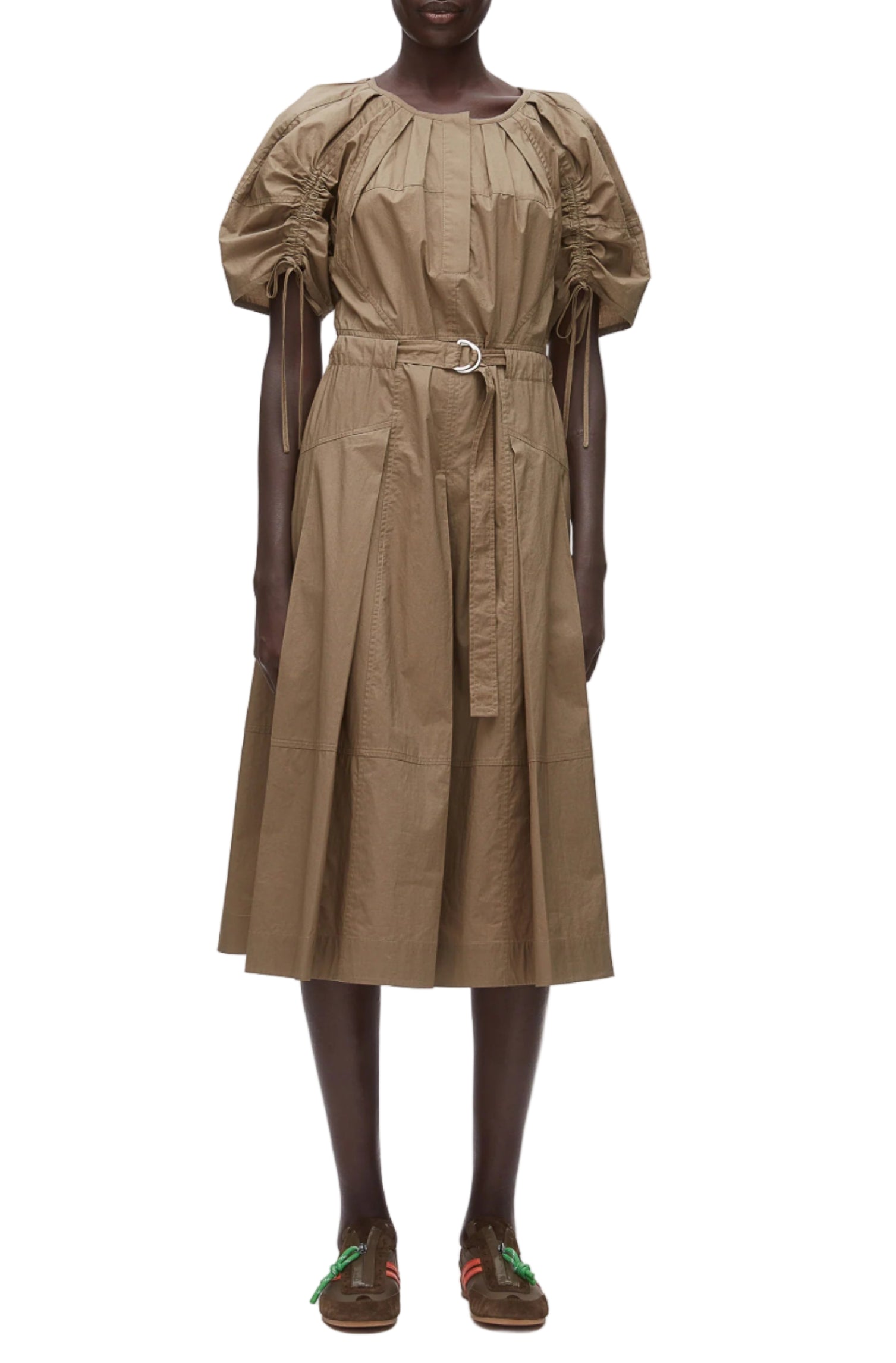 A person wearing the 3.1 Phillip Lim Ruched Sleeve Midi Dress in tan cotton poplin with a D-ring belt and brown loafers stands facing forward against a white background.