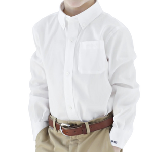 A person wearing a white button-down shirt made of Supima Cotton, tucked into beige trousers, complemented by a Brown Bowen & Co. Arrow Cotton Dress Shirt featuring a Bowen Arrow logo. The image shows only the torso and lacks a visible head.