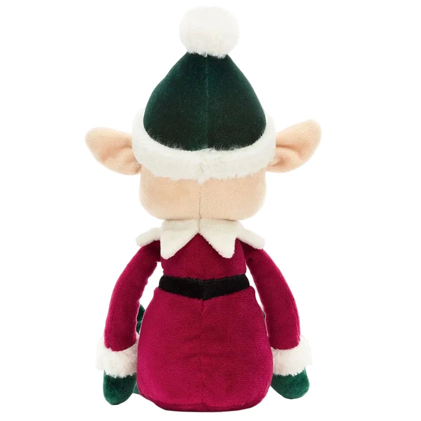 Back view of a Jellycat Eldo Elf plush doll wearing a green and red outfit with a matching hat.
