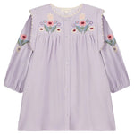 The Louise Misha Baby Girls’ and Girls’ Anette Dress is a light purple long-sleeve corduroy dress with front buttons, colorful floral embroidery on the chest and sleeves, and a charming embroidered yoke, displayed against a white background.