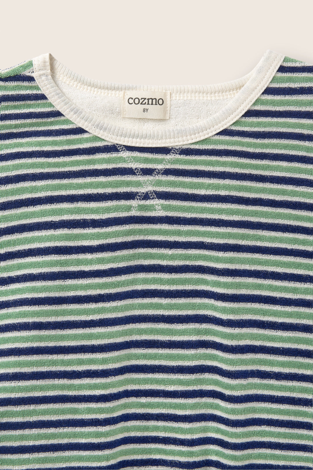 Close-up of the Boys' Enea Terry T-Shirt by Cozmo, featuring comfortable short sleeves and blue, green, and white horizontal stripes, plus a "cozmo" label on the collar.
