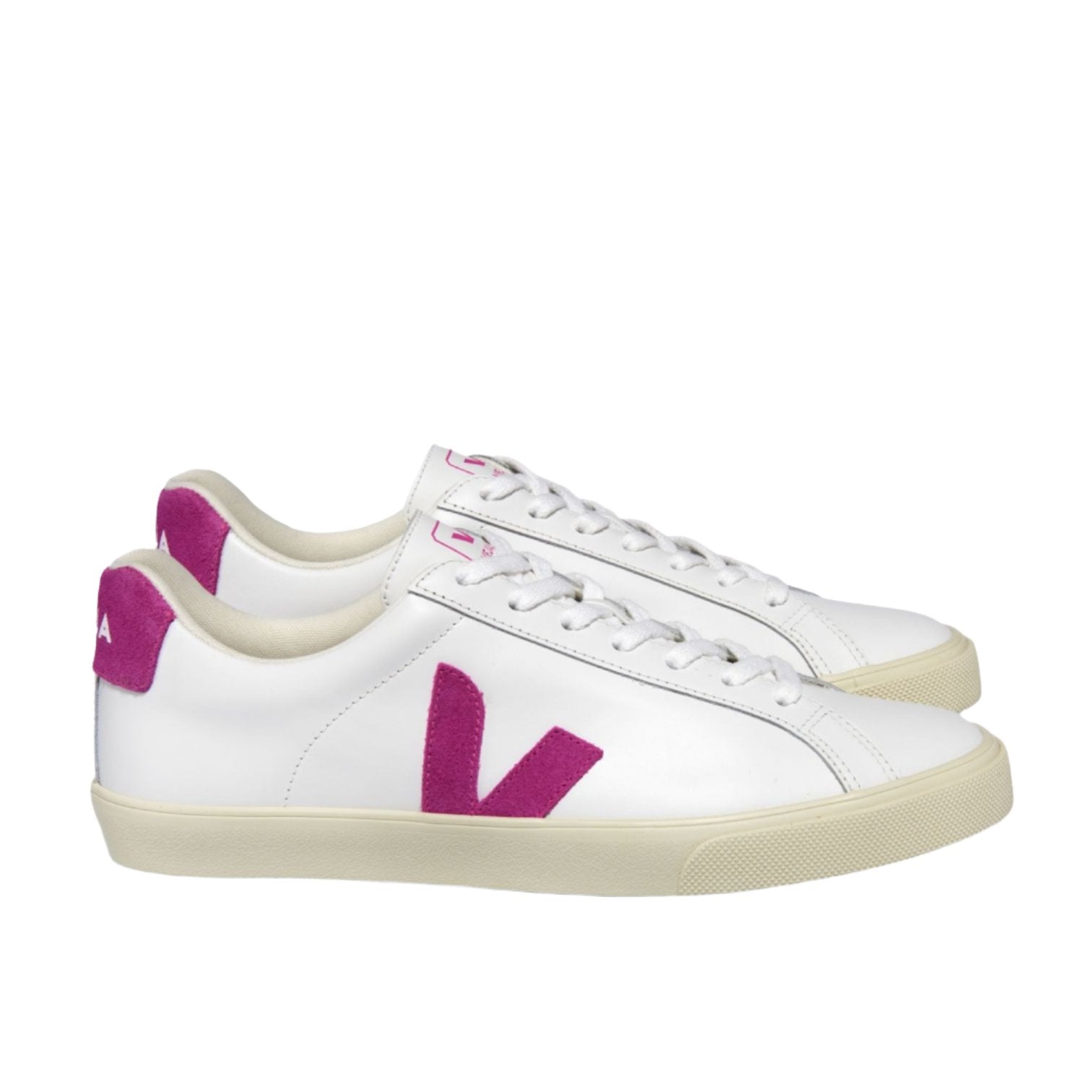 The VEJA Esplar Leather Women's Sneaker by Veja features white leather with pink detailing, including a stitched pink "V" logo on the side and a pink heel tab. These sneakers are completed with white laces and beige soles.