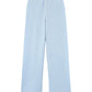 The Everywear Cashmere Pant by Guest in Residence is a light blue, high-waisted, wide-leg style in a lightweight cashmere-linen blend with a front button closure and no visible pockets, shown laid flat on a white background.