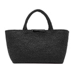 The East West Raffia Chelsea Tote by Proenza Schouler, a black woven handbag with two short handles, is shown against a white background—a structured and stylish tote ideal for carrying your essentials.