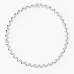 The Edith Necklace by Lie Studio features sterling silver-plated, curve-shaped links in a repeating oval pattern for an elegant, timeless look.