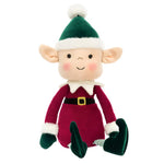 Introducing the Jellycat Eldo Elf, a charming plush doll perfect for adding festive spirit with his vibrant red outfit. Sporting a green hat and shoes, this delightful figure from Jellycat is ready to brighten any holiday setting while sitting upright.