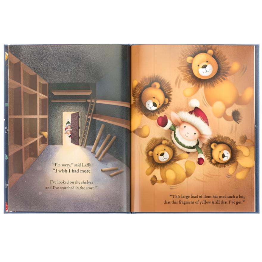 An open children's book titled "Jellycat Eldo Elf and the Patchwork Bashful Bunny Book" by Jellycat shows Eldo Elf in a storage room and another scene where he's surrounded by lions. The text reads, "I'm sorry," said Lefty. "I wish I had more," and "This large load of lions.