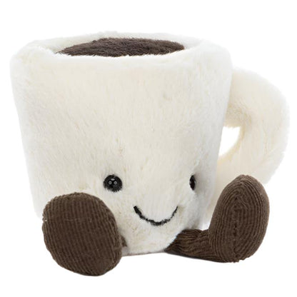 Jellycat's Amuseables Espresso Cup is a cute plush toy shaped like a white coffee mug with a smiling face, black eyes, and brown corduroy feet—part of the Amuseables collection.