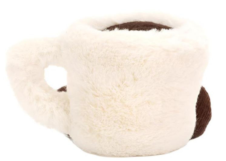 The Jellycat Amuseables Espresso Cup is a plush toy shaped like a white coffee mug with a handle and brown interior, shown against a plain white background.