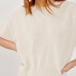 Sablyn Evie Sweater in a cream-colored, relaxed-fit, short-sleeve design with a crew neckline.