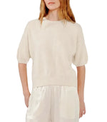 Cream-colored Sablyn Evie Sweater in a relaxed, short-sleeve cashmere knit.