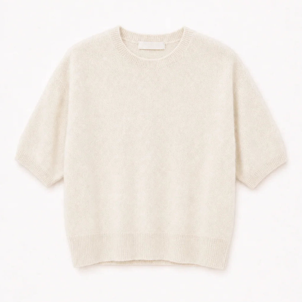 Cream-colored Sablyn Evie Sweater in a relaxed-fit cashmere knit with short sleeves, a crew neckline, and ribbed trim.