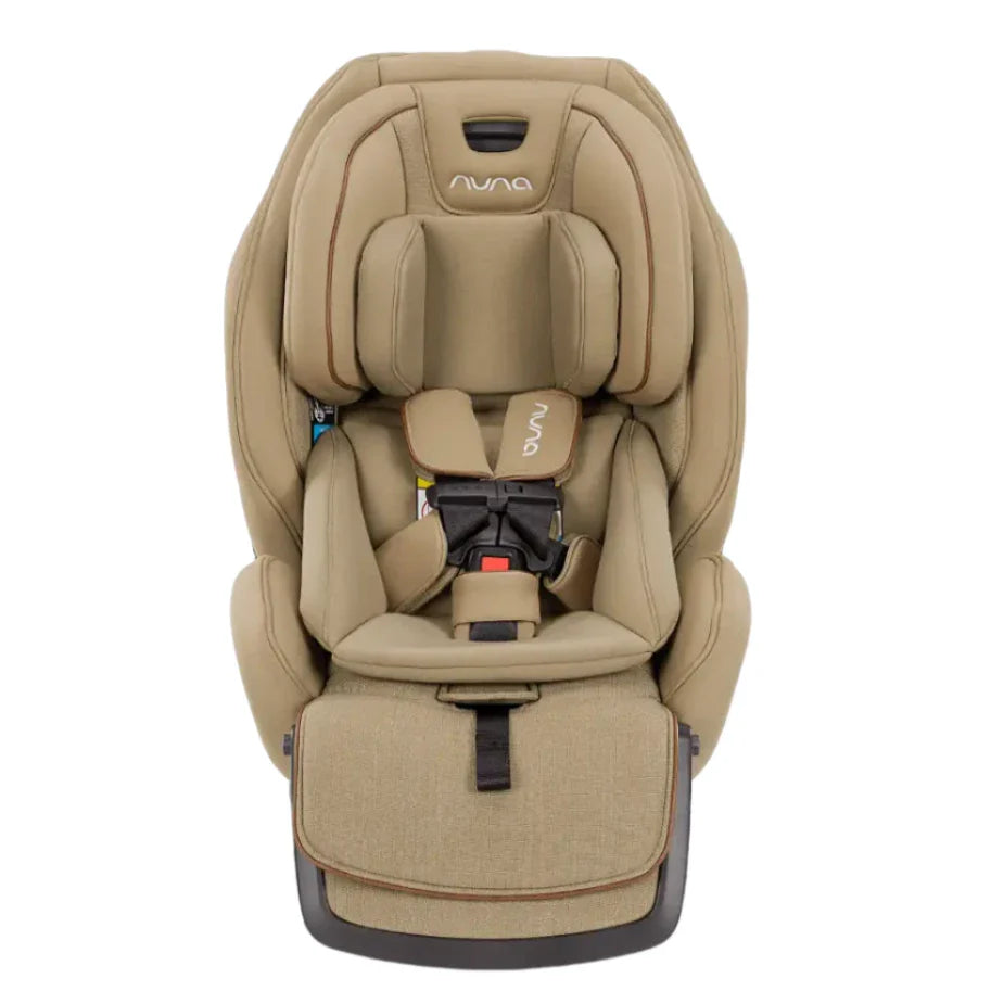 Nuna EXEC with Slip Cover and 2nd Insert by Nuna features a tan color, adjustable headrest, Aeroflex side impact protection system, harness system, and padded seating designed for child safety and comfort.