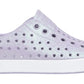 The Kids’ Jefferson Bio-Bling™ by Native Shoes features a lavender slip-on design with a biodegradable glitter finish, a perforated upper, and a lightweight white EVA rubber toe and sole.