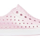 Introducing the Kids’ Jefferson Bio-Bling™ by Native Shoes—a pink, side-view slip-on sneaker featuring a white sole, perforated design, and shimmering biodegradable glitter. Made from lightweight EVA, these water-friendly shoes deliver eco-conscious sparkle and all-day comfort.