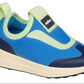 The Kids’ Robbie Dash Sneakers from Native Shoes showcase a breathable mesh upper in blue and light green, complemented by a cream sole and dark blue accents on the toe and heel, displayed against a white background.