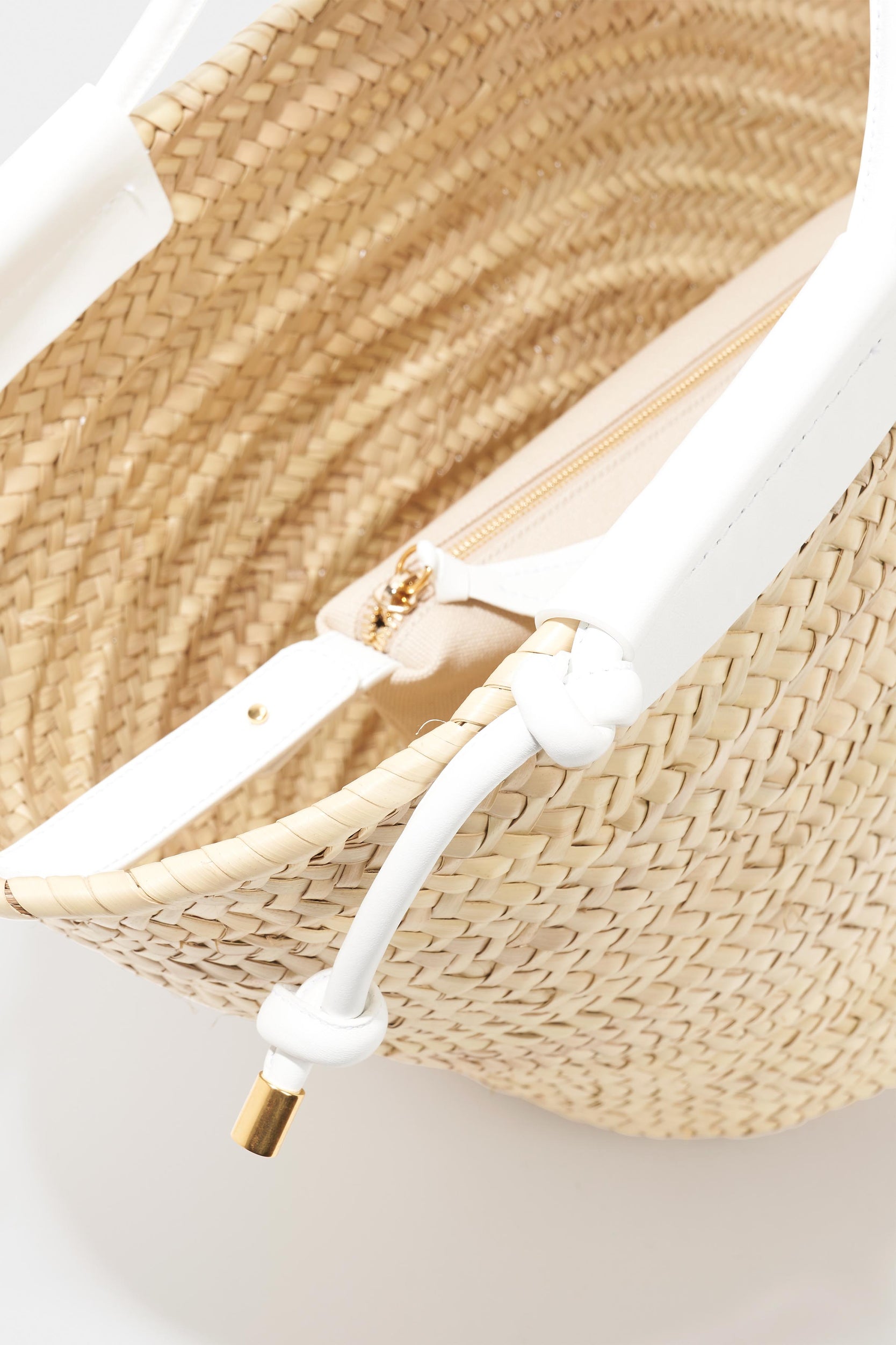 Seen from above, the Altuzarra Basket Tote by Altuzarra showcases white leather straps and includes an interior zippered pouch.