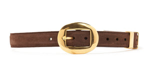 The Altuzarra Vintage Brass Buckle Belt by Altuzarra is a brown suede belt made in Italy, featuring a large, round gold vintage brass buckle and multiple adjustment holes.