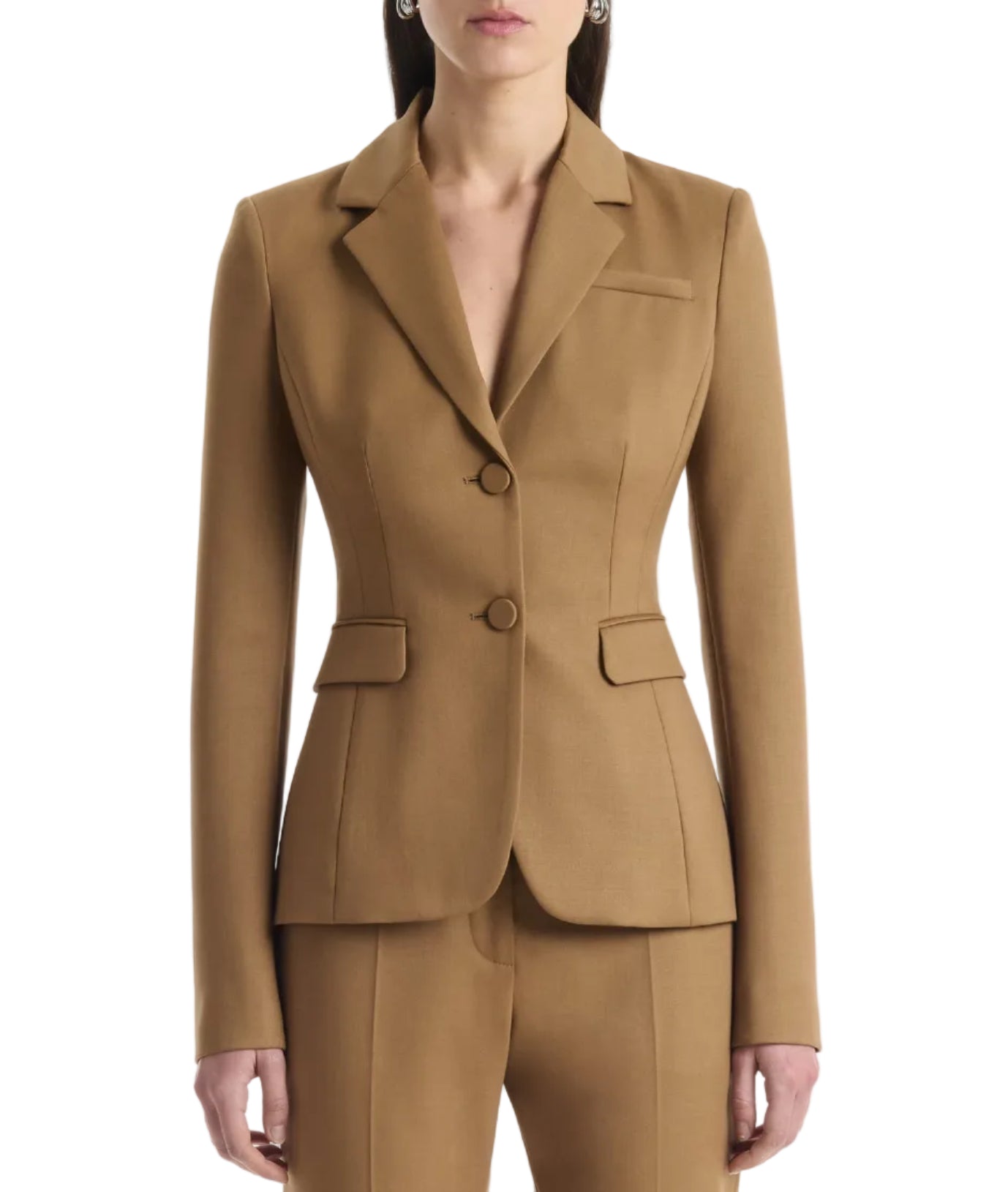 A person wearing the Altuzarra Fenice Jacket, expertly tailored in a camel-colored virgin wool blend with matching pants, stands against a plain background.