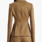 A person is photographed from the back against a plain white background, wearing a fitted tan Fenice Jacket by Altuzarra with matching virgin wool blend trousers, showcasing timeless classic suiting style.