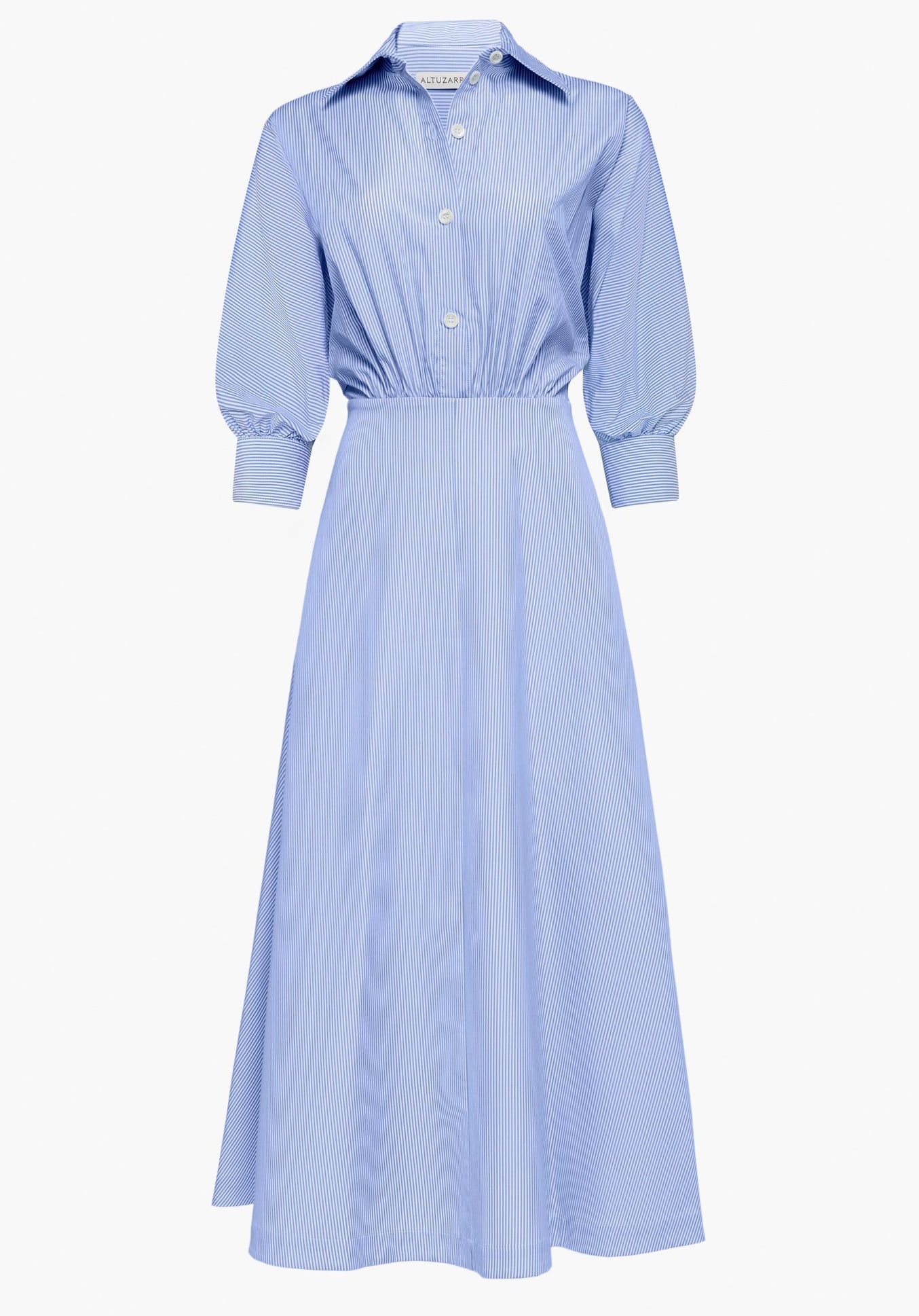 The Eleanor Dress by Altuzarra is a light blue, long-sleeved, collared midi cotton dress featuring a subtle pinstripe pattern, front button closure, and a fitted waist. Expertly crafted in Italy.