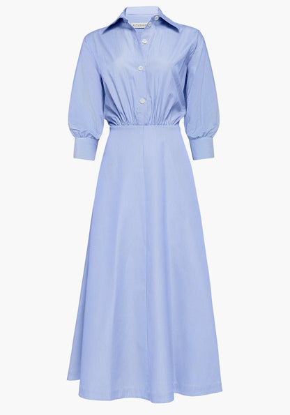 The Eleanor Dress by Altuzarra is a light blue, long-sleeved, collared midi cotton dress featuring a subtle pinstripe pattern, front button closure, and a fitted waist. Expertly crafted in Italy.