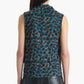 A model is shown from the back against a white background, wearing the Altuzarra Holt Top—a sleeveless blue and brown leopard print design with a draped neckline—paired with black leather pants. The top’s relaxed silhouette adds effortless style to the ensemble.