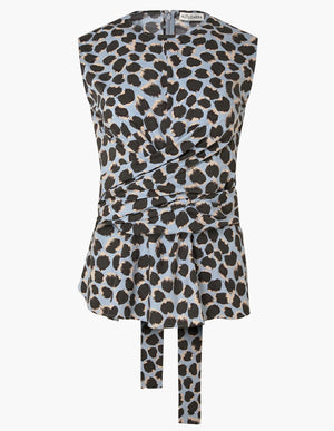 The Tizzy Top by Altuzarra is a sleeveless piece showcasing a blue, black, and beige leopard print. It features a round neckline, a cinched waist with belted detail, and long fabric ties at the front.
