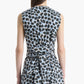 A person is shown from the back wearing the Altuzarra Tizzy Top, a sleeveless piece featuring a blue and black animal print, round neckline, gathered waist, and layered skirt detail.