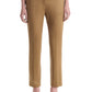 Wearing the Altuzarra Todd Pant in tan, styled with open-toe heels, this individual stands against a plain white background.