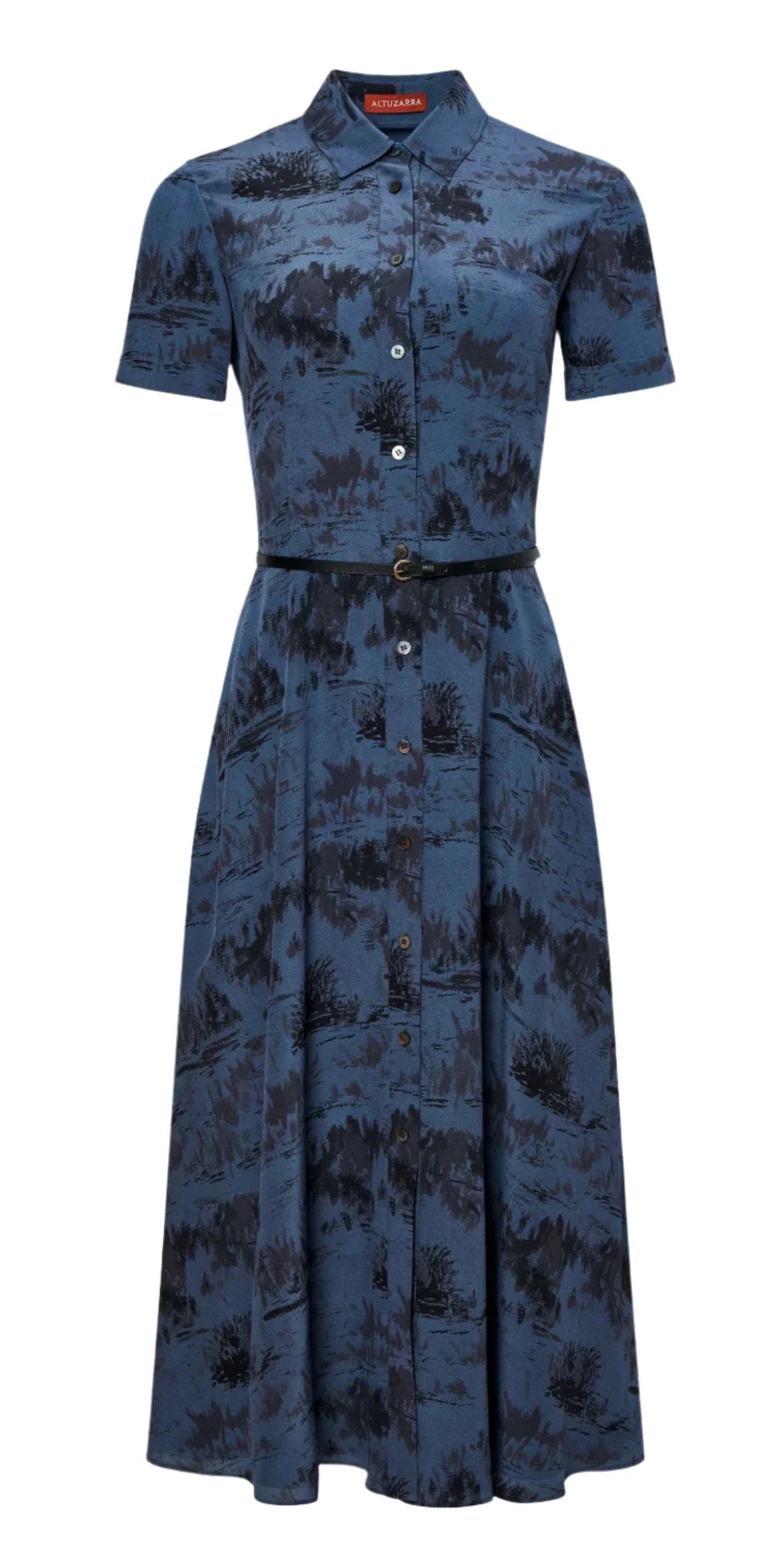 The Altuzarra Kiera Dress by Altuzarra is a blue button-up silk dress adorned with a black abstract pattern and short sleeves. It comes with a leather waist belt, providing both elegance and modern flair.