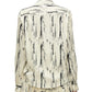 A person wearing a 3.1 Phillip Lim Abstract Wood Grain Crossover Drape Blouse, featuring long sleeves and black abstract wood grain streaks, viewed from the back.