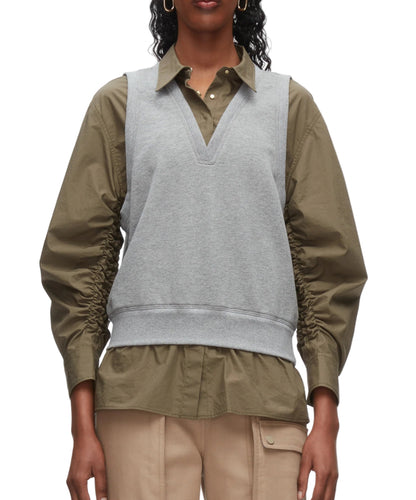 A person wears the 3.1 Phillip Lim Layered Vest Ruched Sleeve Shirt, styled with beige cargo pants.