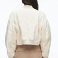 Person stands with their back to the camera, wearing the 3.1 Phillip Lim Cropped Sherpa Combo Bomber in cream and beige pants against a plain background.