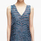 A woman models the 3.1 Phillip Lim Tiger Print Studded Midi Dress, featuring a sleeveless V-neck design with blue and brown zebra-like abstract tiger stripes, shown from shoulders to waist against a plain background.