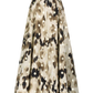 The Ikat Polka Parker Skirt by Lela Rose is a knee-length, high-waisted full skirt crafted from lightweight fabric and adorned with a beige, brown, and black abstract spot pattern.
