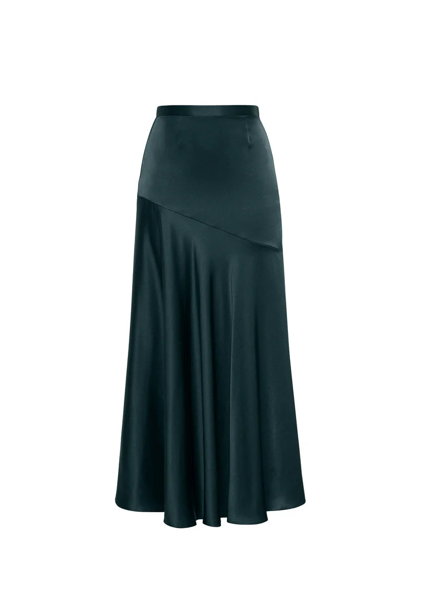 The Tess Silk Charmeuse Skirt by Adam Lippes features dark teal satin, an asymmetrical seam, and a chic bias cut that flares from the waist.