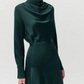 A person wearing the Adam Lippes Tess Silk Charmeuse Skirt, standing against a plain light background.
