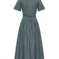 The Doron Stripe Shirting Dress by Adam Lippes features green and white stripes, organic cotton, short sleeves, mandarin collar, fitted waist, and a matching belt.