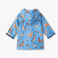 Hatley Baby Boys’ and Boys’ Blue Little Pups Rain Coat with a hood, featuring an illustrated print of various dog breeds in different poses.