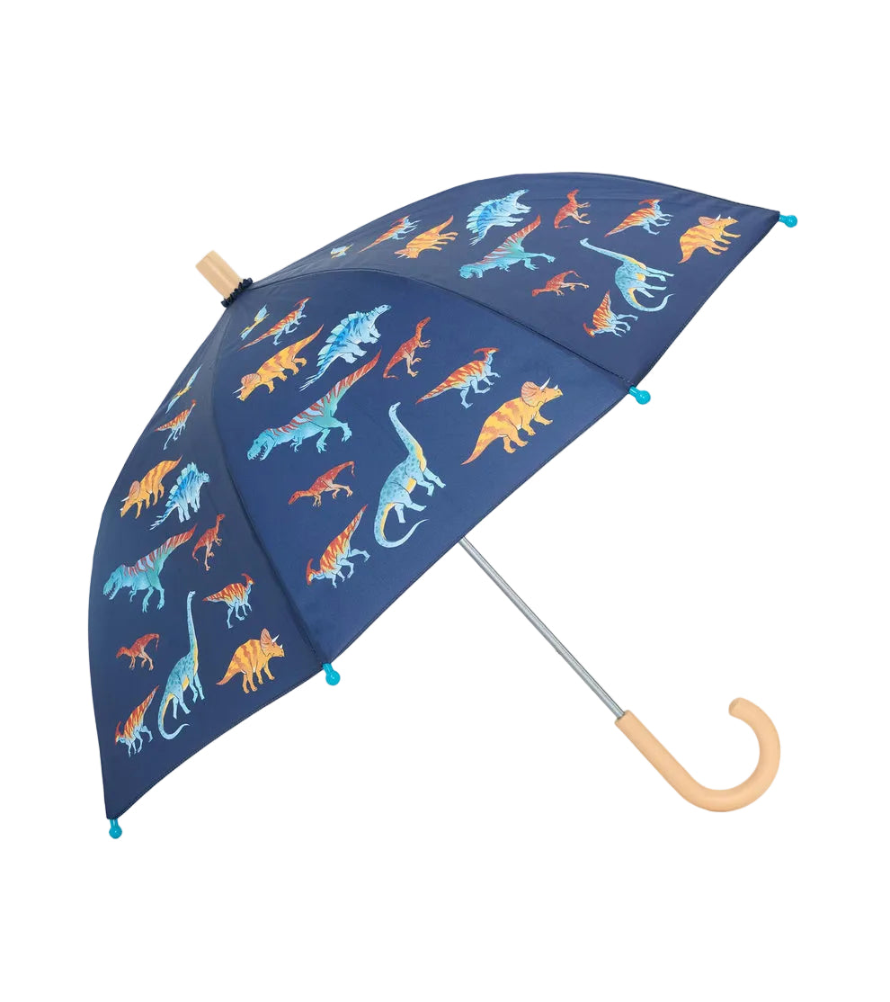 The Hatley Kids’ Umbrella is designed in navy blue with a wooden handle and showcases vibrant dinosaur illustrations on its durable polyester canopy.