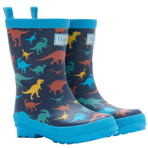 Hatley’s Boys’ Colourful Dinos Matte Rain Boots feature a blue rubber exterior with vibrant dinosaur silhouettes, waterproof construction, sturdy blue soles, and handy pull tabs—ideal for adventurous kids.