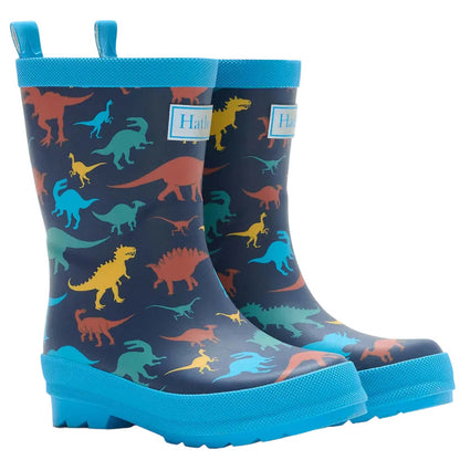 Hatley’s Boys’ Colourful Dinos Matte Rain Boots feature a blue rubber exterior with vibrant dinosaur silhouettes, waterproof construction, sturdy blue soles, and handy pull tabs—ideal for adventurous kids.